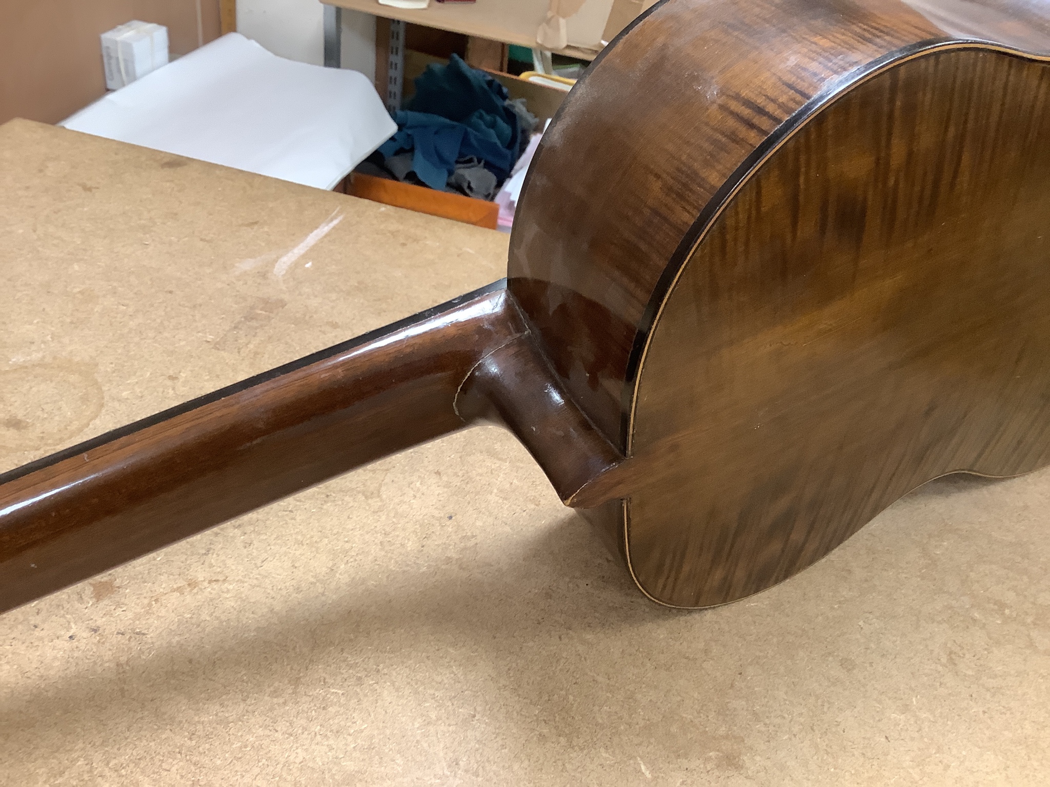 A Harald Petersen classical concert guitar, paper label interior, with hard case. Length of back 49cm excluding button